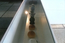 Photographie d'une vitrine de l'exposition <em><strong>De la Boule à la bourlette</strong></em> de Bernard Josse dans le cadre de la biennale ARTour, 2005